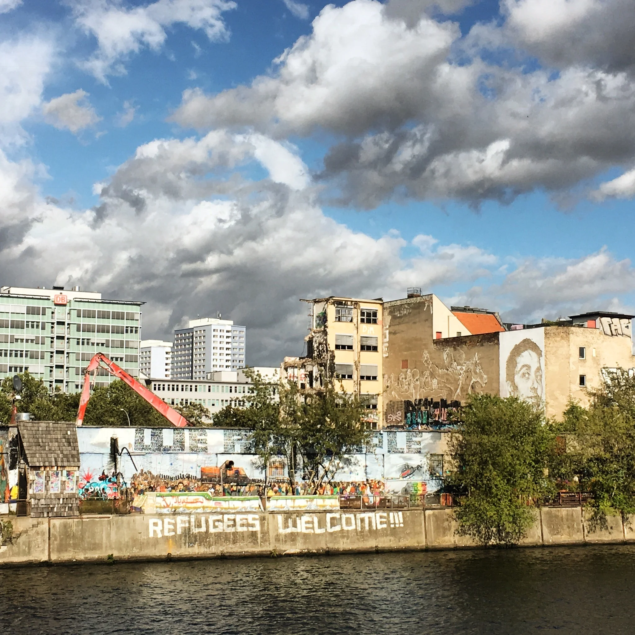The YAAM, from a nearby bridge. The "beach" is over to the right of the trees, and the building shown contains the indoor winter space, washrooms, etc. 