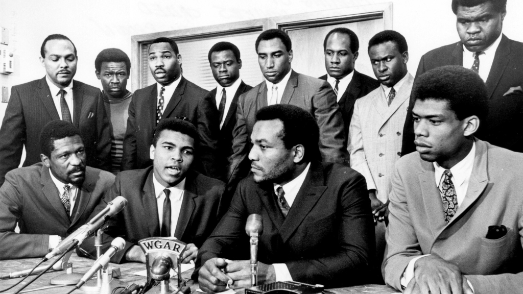 Former Cleveland Browns Hall of Fame running back Jim Brown presides over a meeting of top African-American athletes on June 4, 1967, to show support for boxer Muhammad Ali’s refusal to fight in Vietnam. Those present are: (front row) Bill Russell, Muhammad Ali, Jim Brown, Lew Alcindor; (back row) Carl Stokes, Walter Beach, Bobby Mitchell, Sid Williams, Curtis McClinton, Willie Davis, Jim Shorter, and John Wooten. Tony Tomsic/Getty Images