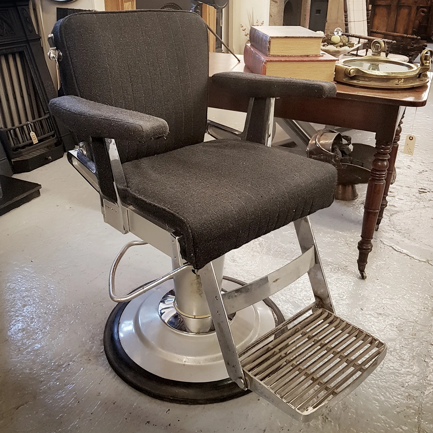 Vintage Belmont barber's chair with chrome base and black upholstered seat in Edinburgh eh16 4ap.