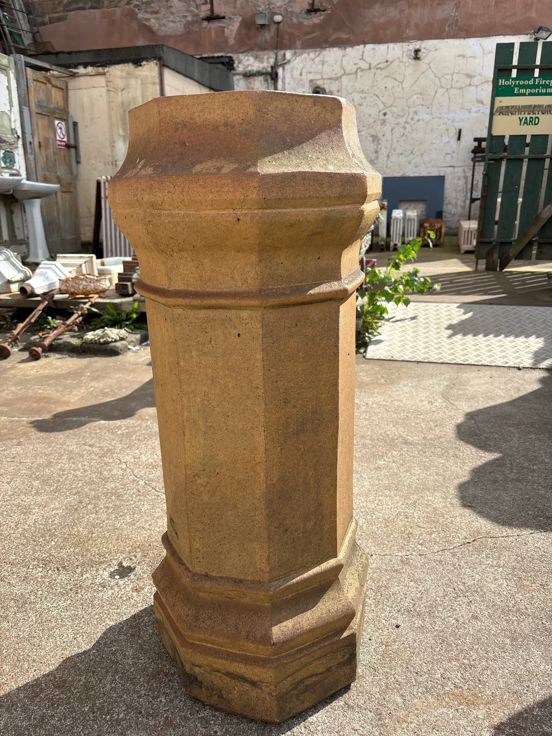 Large terracotta chimney pot with decorative banding, ideal as statement garden planter
