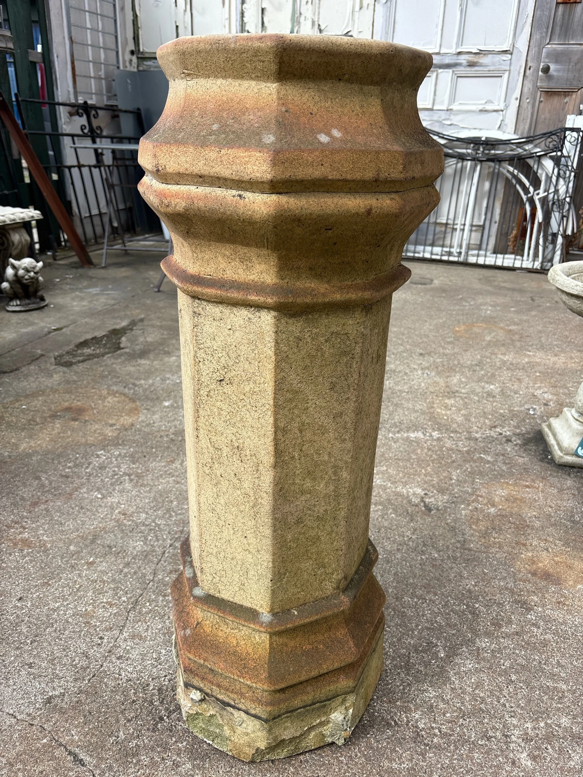 Antique tall round terracotta chimney pot with aged patina, ideal for use as a garden planter