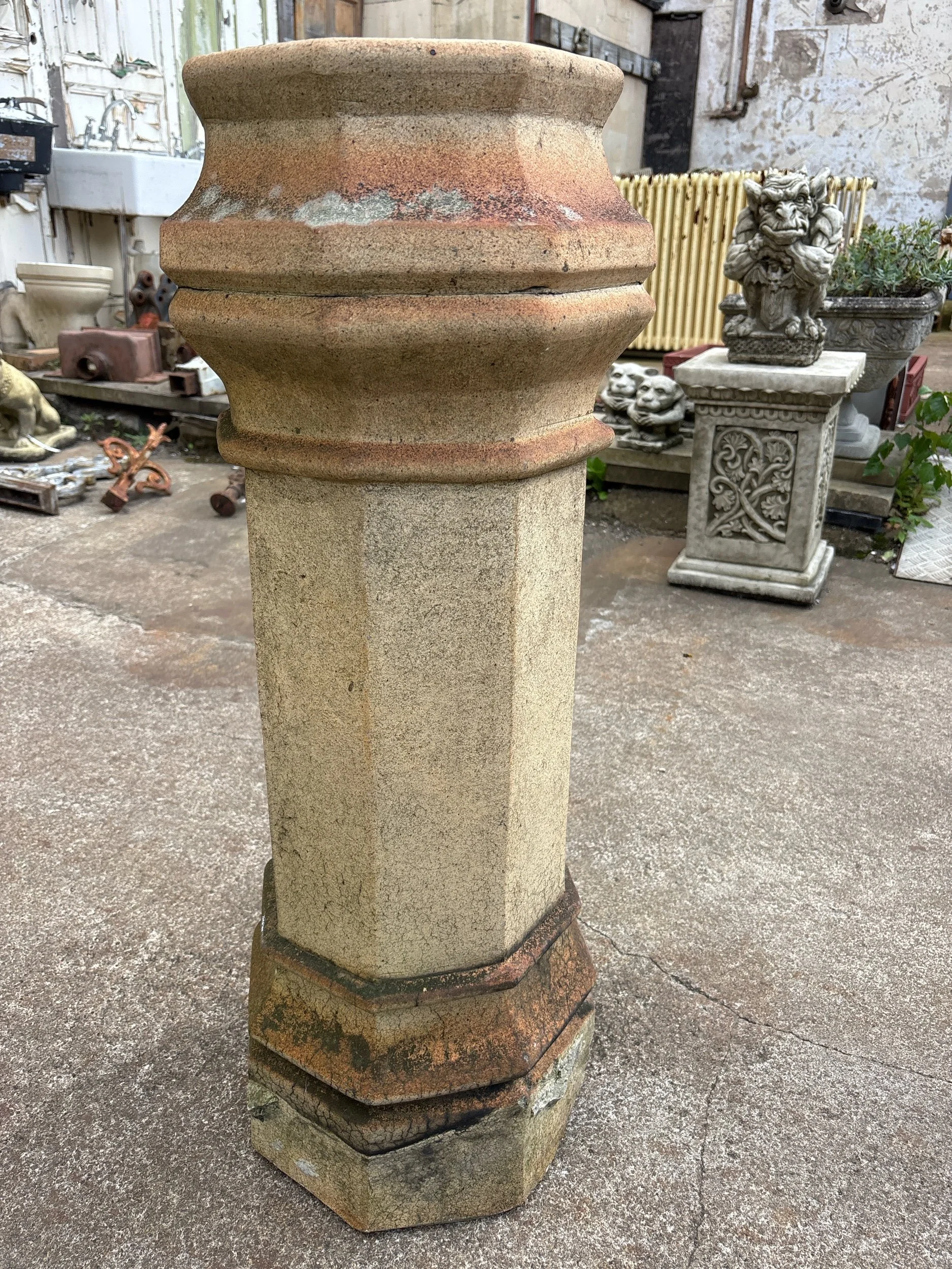 Reclaimed Victorian octagonal chimney pot with natural lichen growth and weathered finish