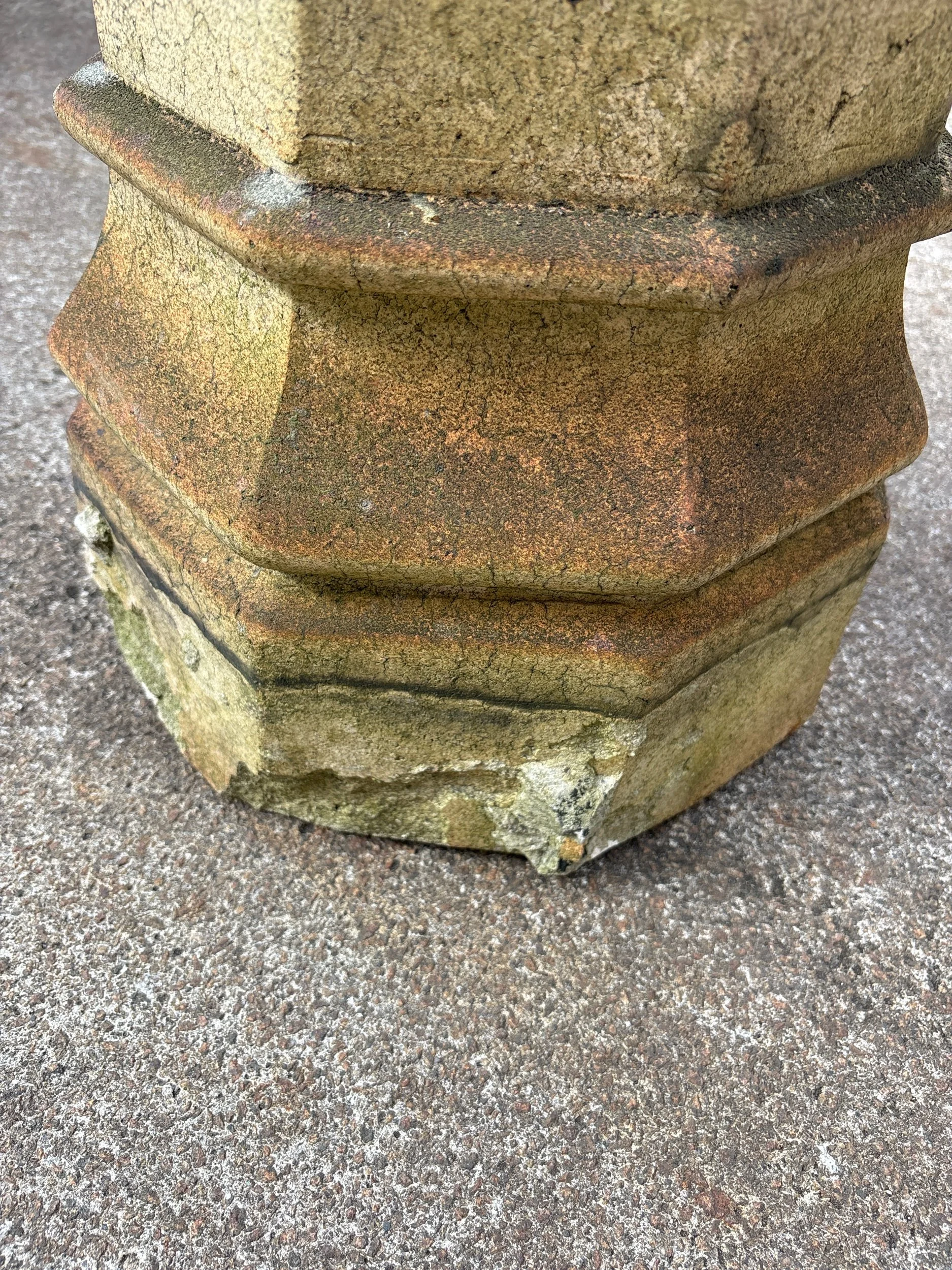 Rustic terracotta chimney pot with moss and lichen, reclaimed for garden or architectural use