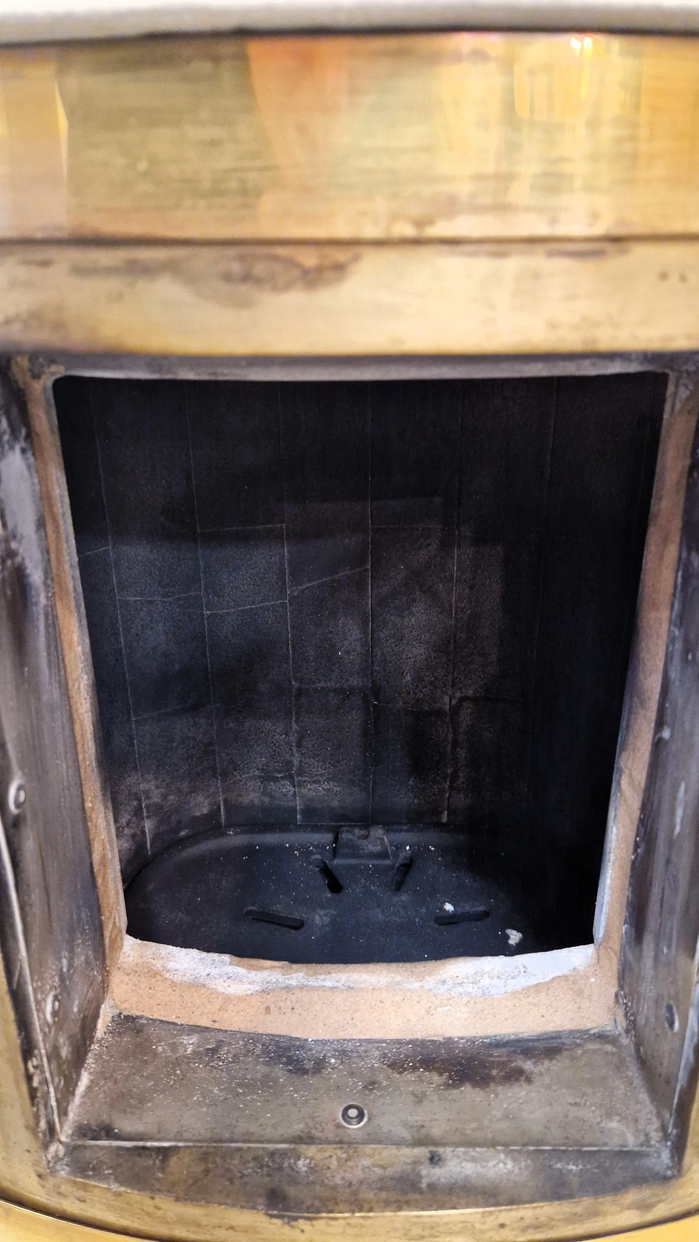 Ornate cast iron & brass wood-burning stove