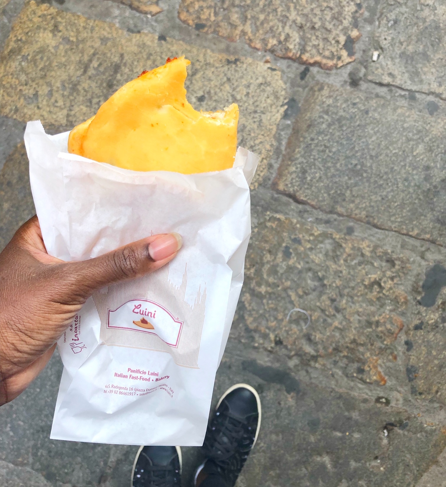 Me taking a bit into a panzerotti from Luini
