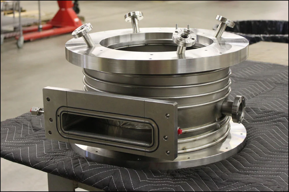 A custom vacuum chamber with cooling traces.