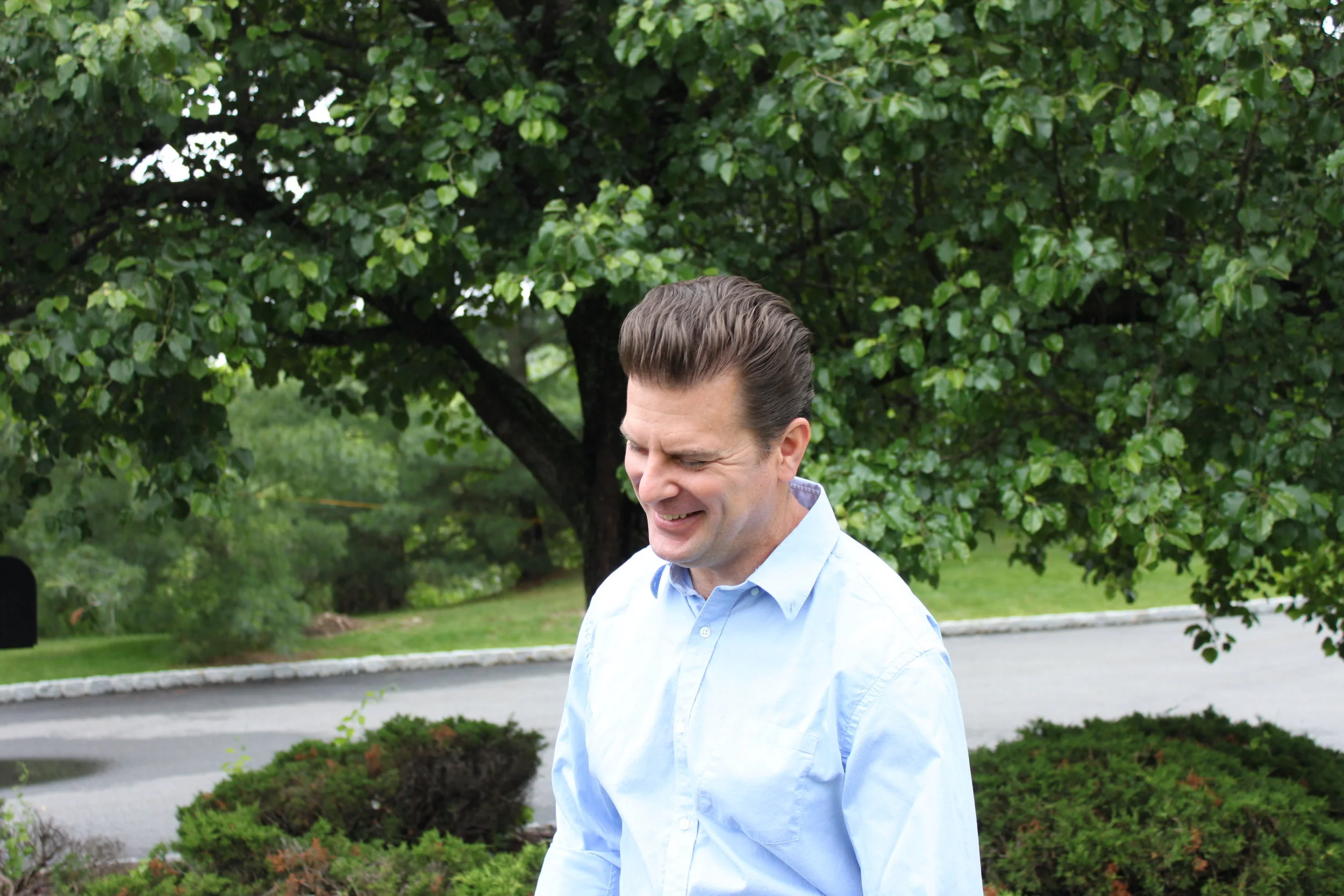 A candid photo from when we took a headshot for the site ; we think it captures Mike's personality well.