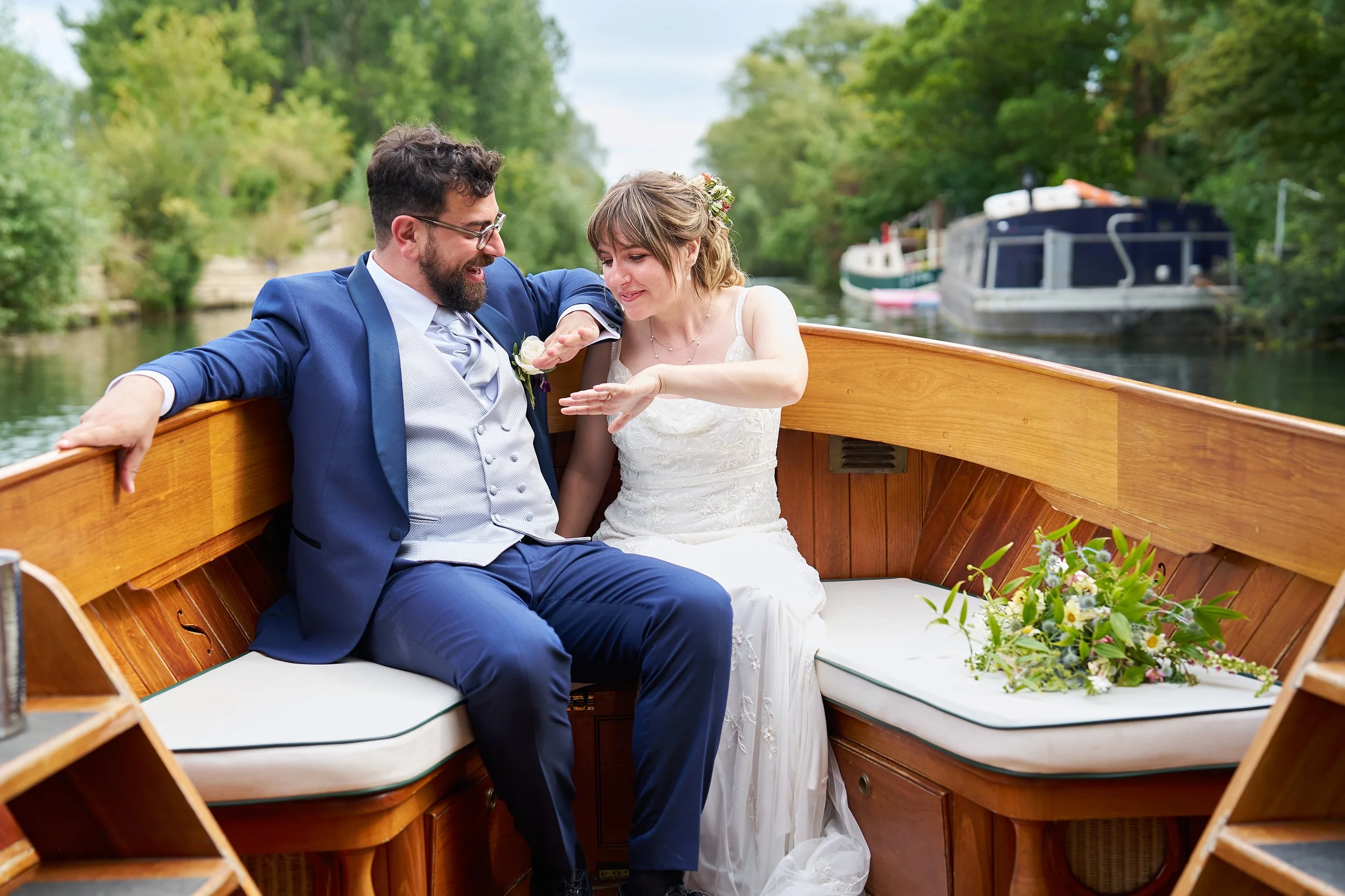 a natural documentary wedding style image of couple getting married at the medley walled garden - a beautiful venue by the side of the river in oxford