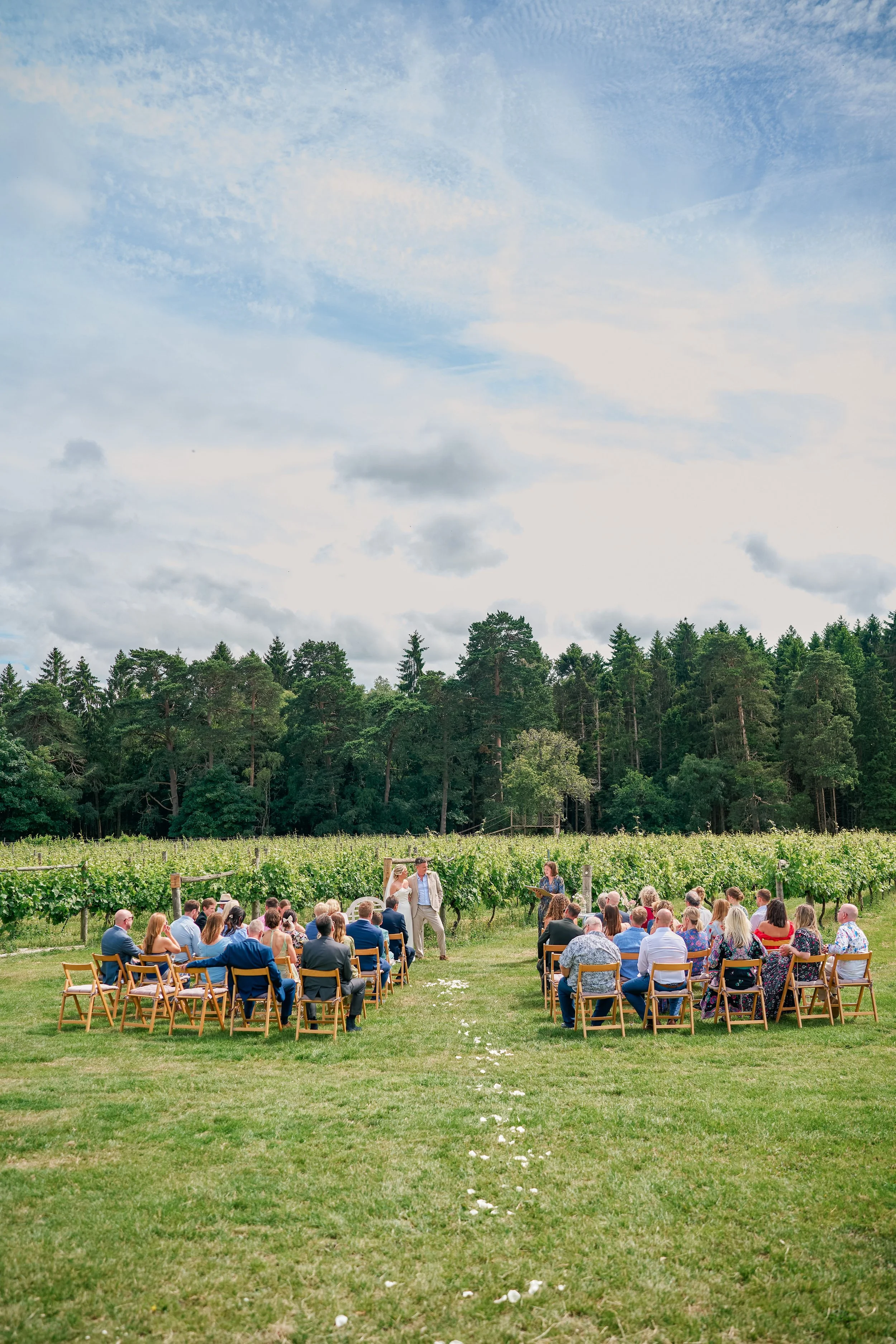 A creative and natural shot of a beautiful outdoor wedding in an oxfordshire vineyard