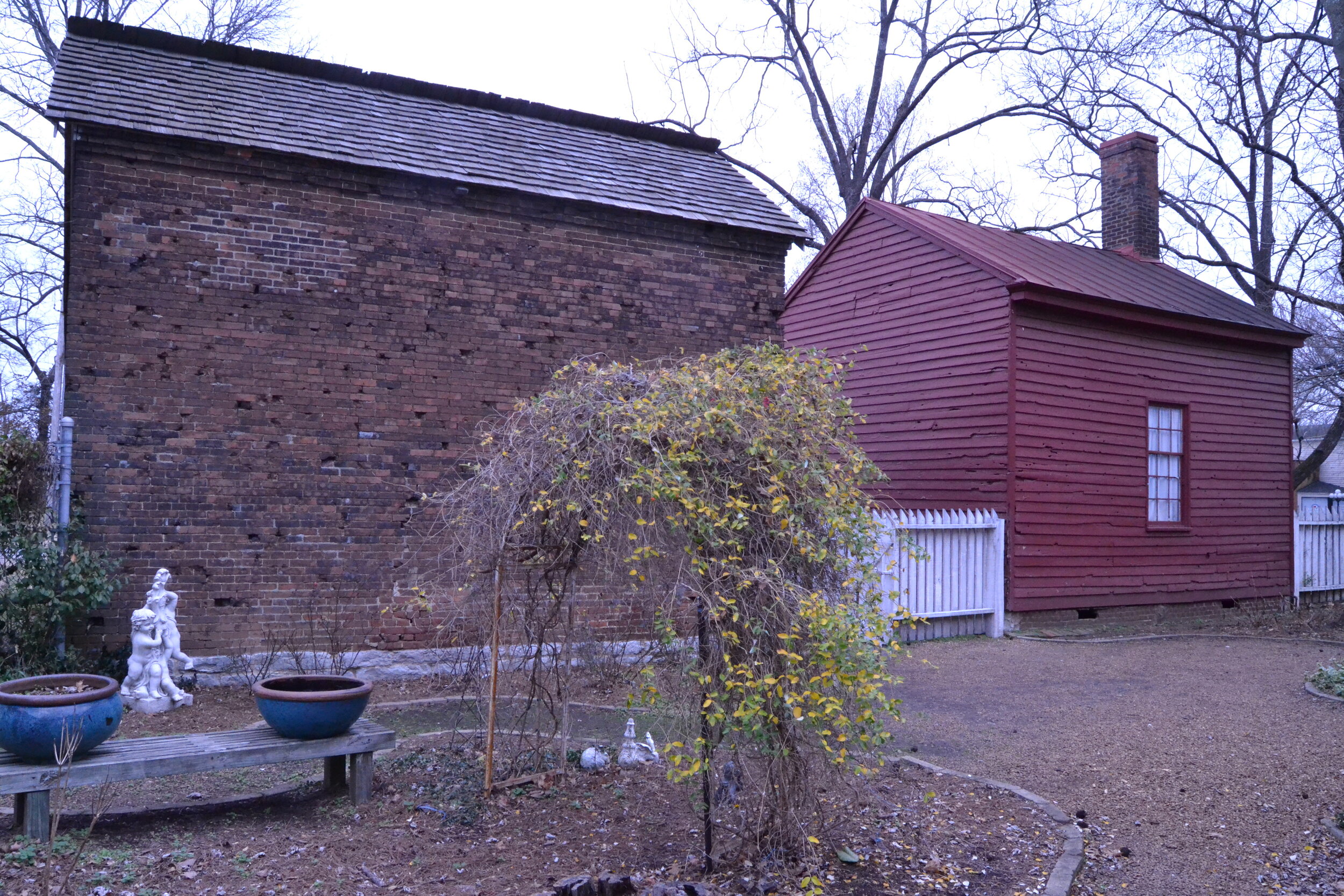 Outbuildings before land reclamation and restoration efforts, 2014