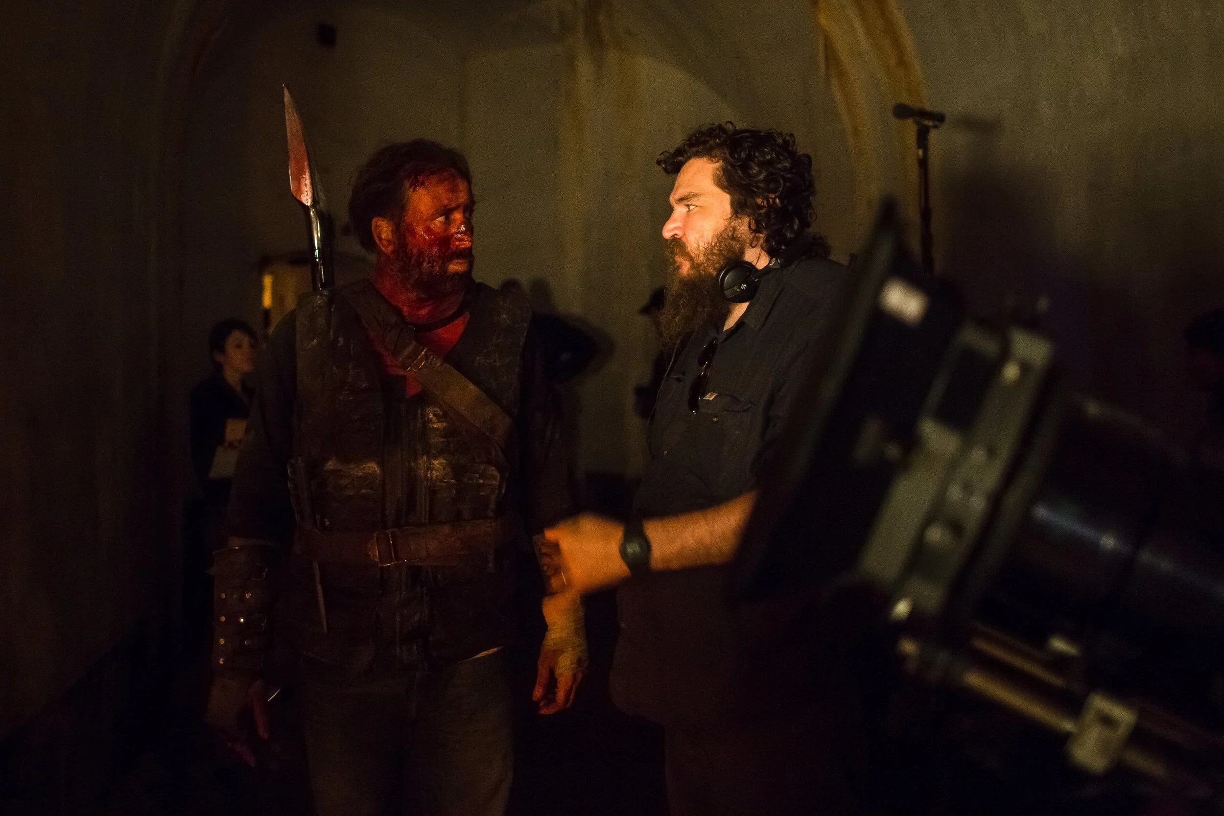 (L-R) Nicolas Cage and Director Panos Cosmatos behind the scenes of the action, thriller film “ MANDY ” an RLJE Films release. Photo courtesy of RLJE Films .