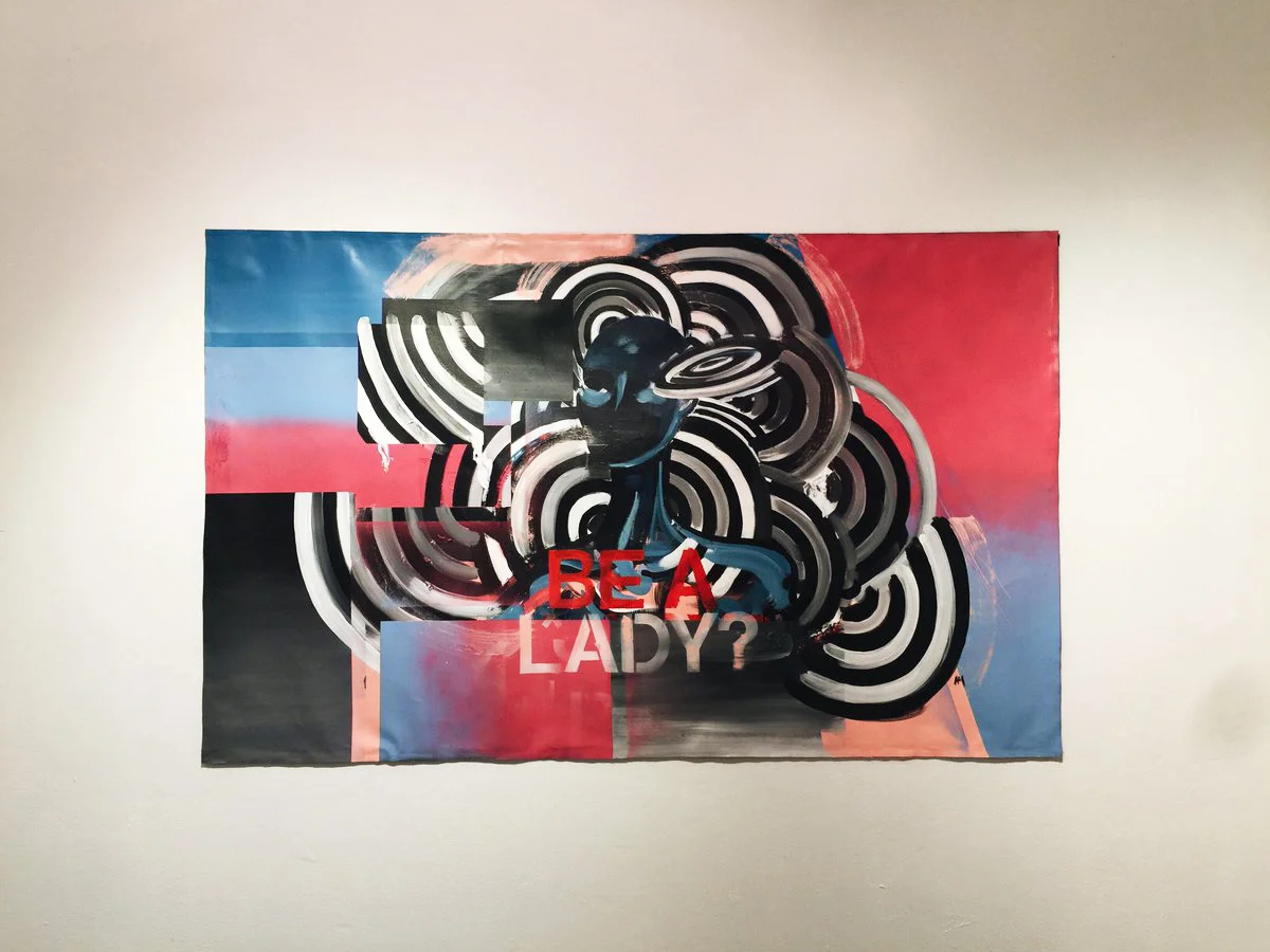 Anti-Pro Exhibition The piece “Be a Lady?” deals with the information that many young girls receive while growing up. We are often taught that to be a lady means to only operate under a set of rules that are deemed feminine and appropriate. The concentric circles , gradients and shifts of space represent the duality of masculine and feminine energy that exists, yet when unable to be expressed causes us to become stuck and trapped within this narrow way of thinking. From this stagnation the figure becomes void of any emotion or personality becoming manikin like, without freedom to express.