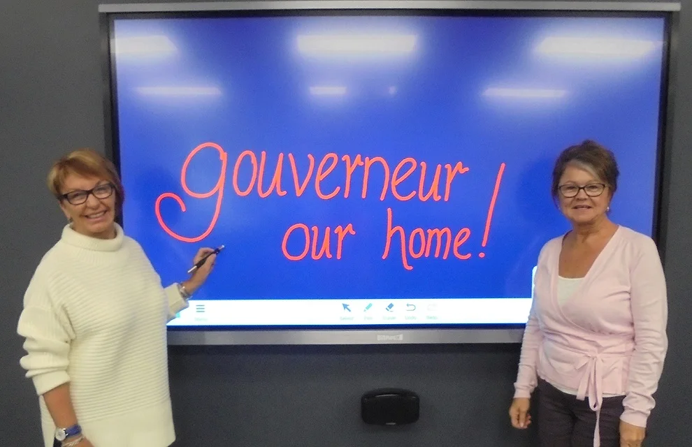 On a recent visit home to Gouverneur, Kay Van Norton Poche (left), now of Sydney, Australia and Gouverneur Community Center board member Donna Lawrence showed off the new Smart Board in the Howard Van Norton Media Room that was made possible by the generous donation made by the Van Norton family to the new center located on State Highway 58. (Wyman photo) 