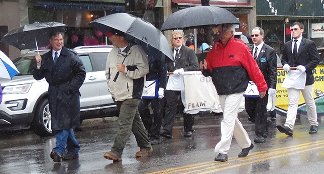 Local dignitaries marching in the parade (from left) SLC Legislator Henry Leader, Town of Gouverneur board member Dave Spilman, Mayor Ron McDougall. Behind are Masonic Lodge No. 217 members (from left) Robert Saidel, Tyler Bowman, Stephen Theraldsen, and Cody Hartle.