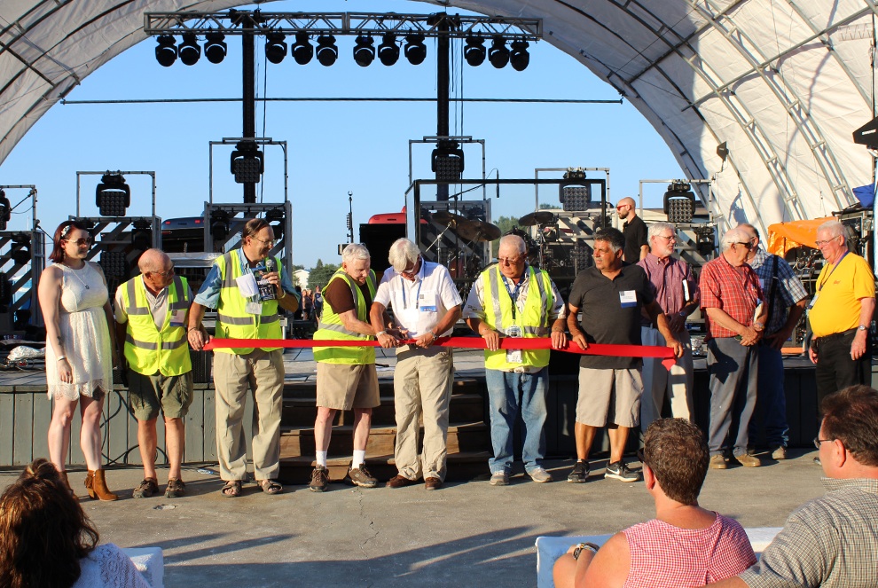 The Gouverneur and St. Lawrence County Fair officially opened on Tuesday, August 1 at 7 p.m. A ceremonial ribbon-cutting was held with Town of Gouverneur Supervisor Bob Ritchie and Village of Gouverneur Mayor Ronald McDougall making the official cut. From left: Britney Mulvaney, Fair President Lyle Hotis, Fair Manager Don Peck, Supervisor Bob Ritchie, Mayor Ron McDougall, Director Dave Bishop, Director Brennan Shampine. (Rachel Hunter photo)