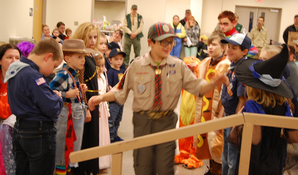  Jack Velez is congratulated and given a final farewell by fellow Cub Scouts during their Halloween Pack Meeting and Crossover Ceremony. (photo provided) 