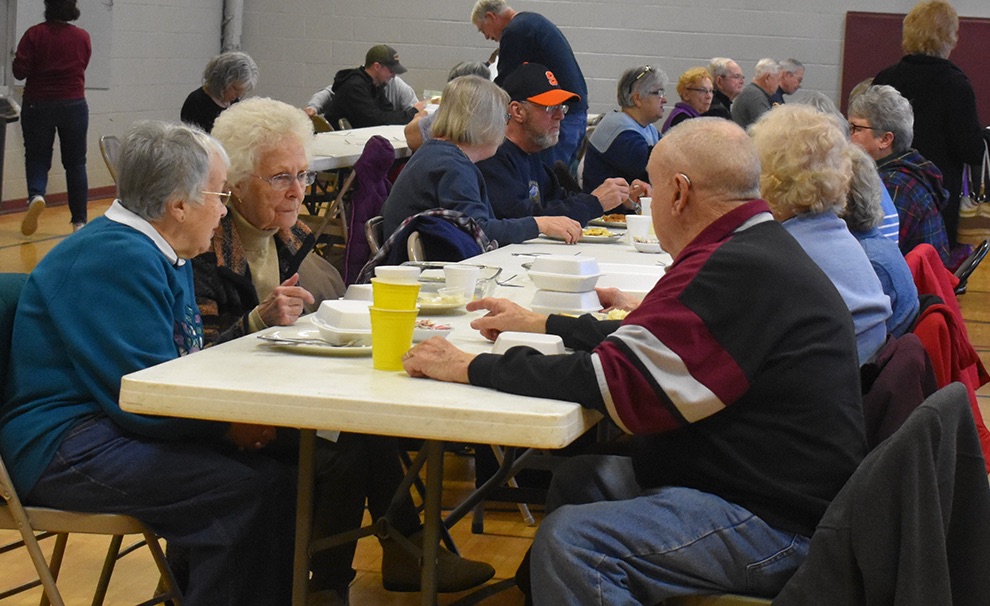   Attendees of the first St. James fish fry of the season enjoy a delicious dinner and each other’s fellowship. (photo by Jessyca Cardinell)  