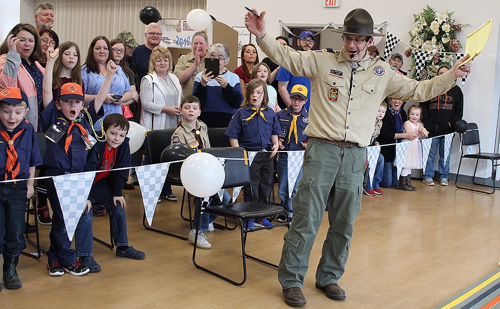   Gouverneur Cub Scout Pack 2035 Cubmaster Chris Gates and cub scouts get excited as derby cars cross the finish line. (Rachel Hunter photo)  