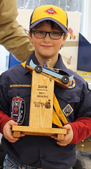   Carter McGill won the Most Creative trophy for turning his pinewood derby car into a pinewood derby boat! Carter McGill is pictured (at right) with Cubmaster Chris Gates (at left). (Rachel Hunter photo)  