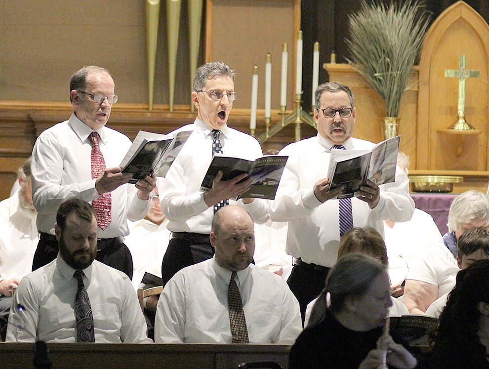  Gouverneur Community Chorus members Harry Smithers, Sid Peters, and Blane Shrewsberry singing during the cantata. (Rachel Hunter photo)  