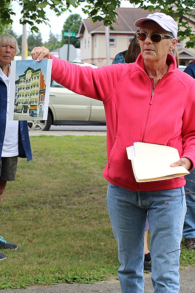   Lea Dickson of Fowler shows off a historic picture of the St. Lawrence Inn. (Rachel Hunter photo)  
