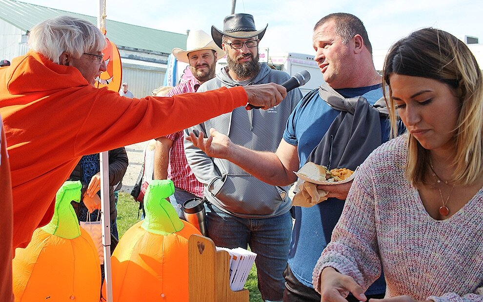   Art Mason of Brier Hill gets interviewed by Village of Gouverneur Mayor Ron McDougall after it was announced that he won the 2019 Gouverneur Pumpkin Festival’s Guess The Pumpkin’s Weight contest. Mr. Mason guessed that the giant pumpkin, grown by L