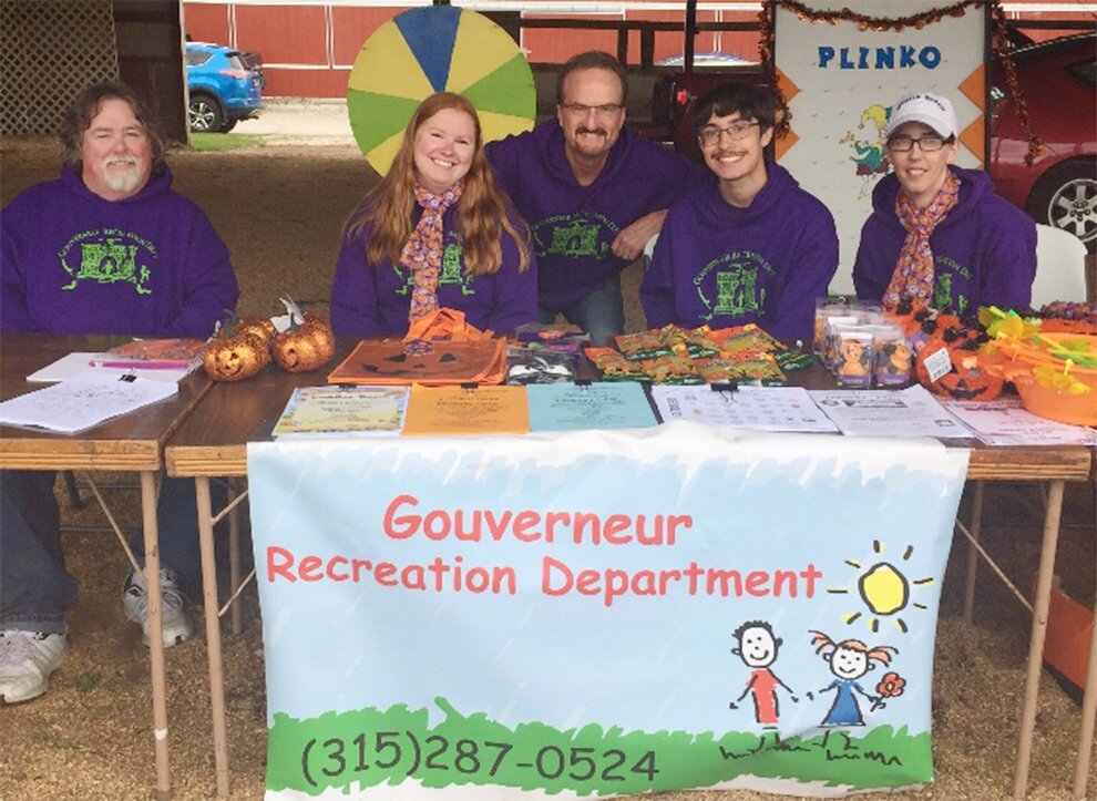   Gouverneur Recreation Director Casey Canell (center) and attendants (from left) Jeff Burt, Kristin Simmons, Connor Canell and Michelle Prashaw offered children’s games and activities on Saturday, September 28 at the 2019 Gouverneur Pumpkin Festival