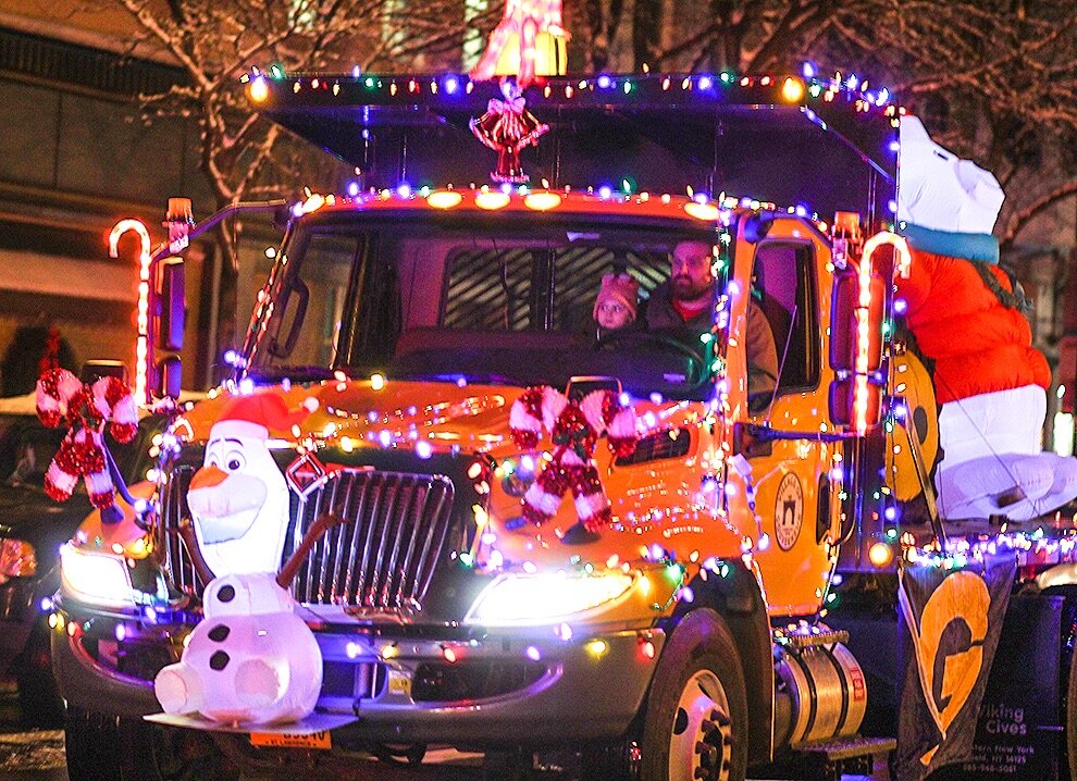  Village of Gouverneur Department of Public Works festively adorned its truck for the 2019 Gouverneur Christmas Parade, sponsored by the Gouverneur Area Chamber of Commerce. The truck was driven by Chris Fitzgerald, and the passenger is his daughter,