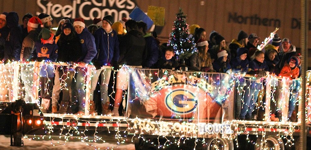  Fear The G! Gouverneur Wildcat Football players on a festive float, pulled by a Town of Gouverneur Highway Department truck during the 2019 Gouverneur Christmas Parade.  