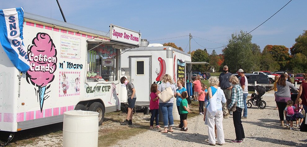   A couple of the food trucks on the Gouverneur Fairgrounds as North Country residents stopped by the 9th Annual Gouverneur Pumpkin Fest to get a taste of their fair food favorites. (Rachel Hunter photo)  
