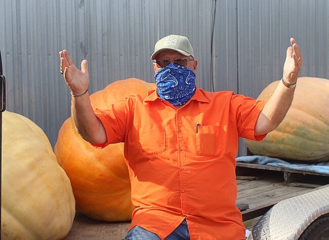   Dave Bishop of DeKalb celebrates his win in the 9th Annual Gouverneur Pumpkin Weigh-Off contest. (Rachel Hunter photo)  