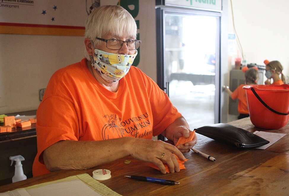   Gouverneur and St. Lawrence County Fair Treasurer Linda Bishop of DeKalb counting tickets at the 9th Annual Gouverneur Pumpkin Fest on Saturday, September 26. (Rachel Hunter photo)  