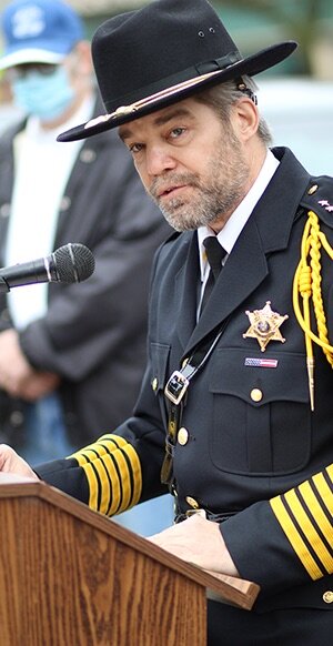    St. Lawrence County Sheriff Brooks Bigwarfe addressing the crowd at the Gouverneur Veterans Day ceremony on Nov. 11 at the Gouverneur Memorial Arch. (Rachel Hunter photo)  