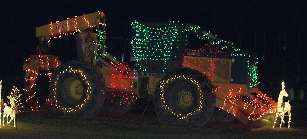    Christmas lights on a piece of equipment at Stowell’s Logging, County Route 11 (Rock Island Road), Gouverneur. (Rachel Hunter photo)  