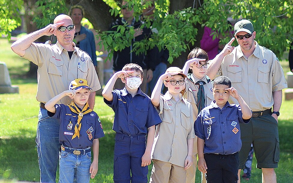    Gouverneur Cub Scout Pack 21 leading the Pledge of Allegiance at the 2021 Gouverneur Memorial Day Observance on May 31 in the Riverside Cemetery in Gouverneur. From left: Cubmaster Derek Gallagher, Liam Gallagher, Victor Correa, Curtis Terpstra-Ma