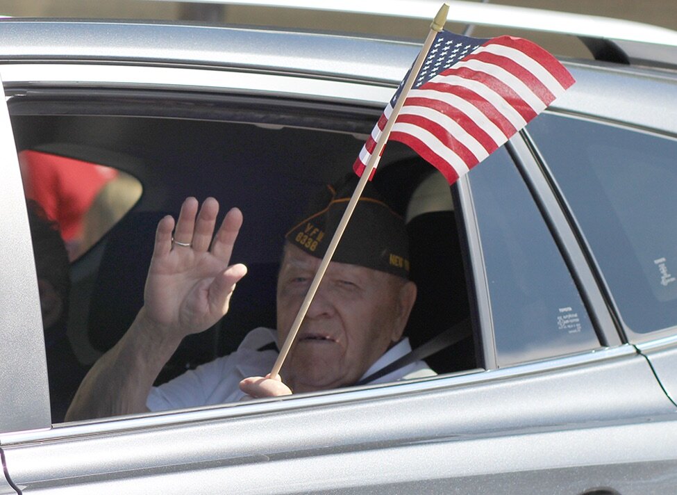   Gouverneur Veteran Donald Payne waves as he travels down the parade route. (Rachel Hunter photo)  