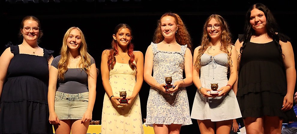   Wildcat Competitive Cheerleading Awards to Rose Cox, Bella Moran, and Ruby Griffith. (Rachel Hunter photo)  