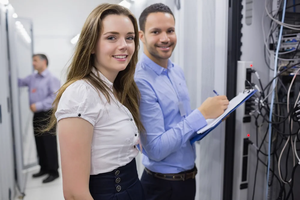 coworkers-smiling-in-data-center.jpg