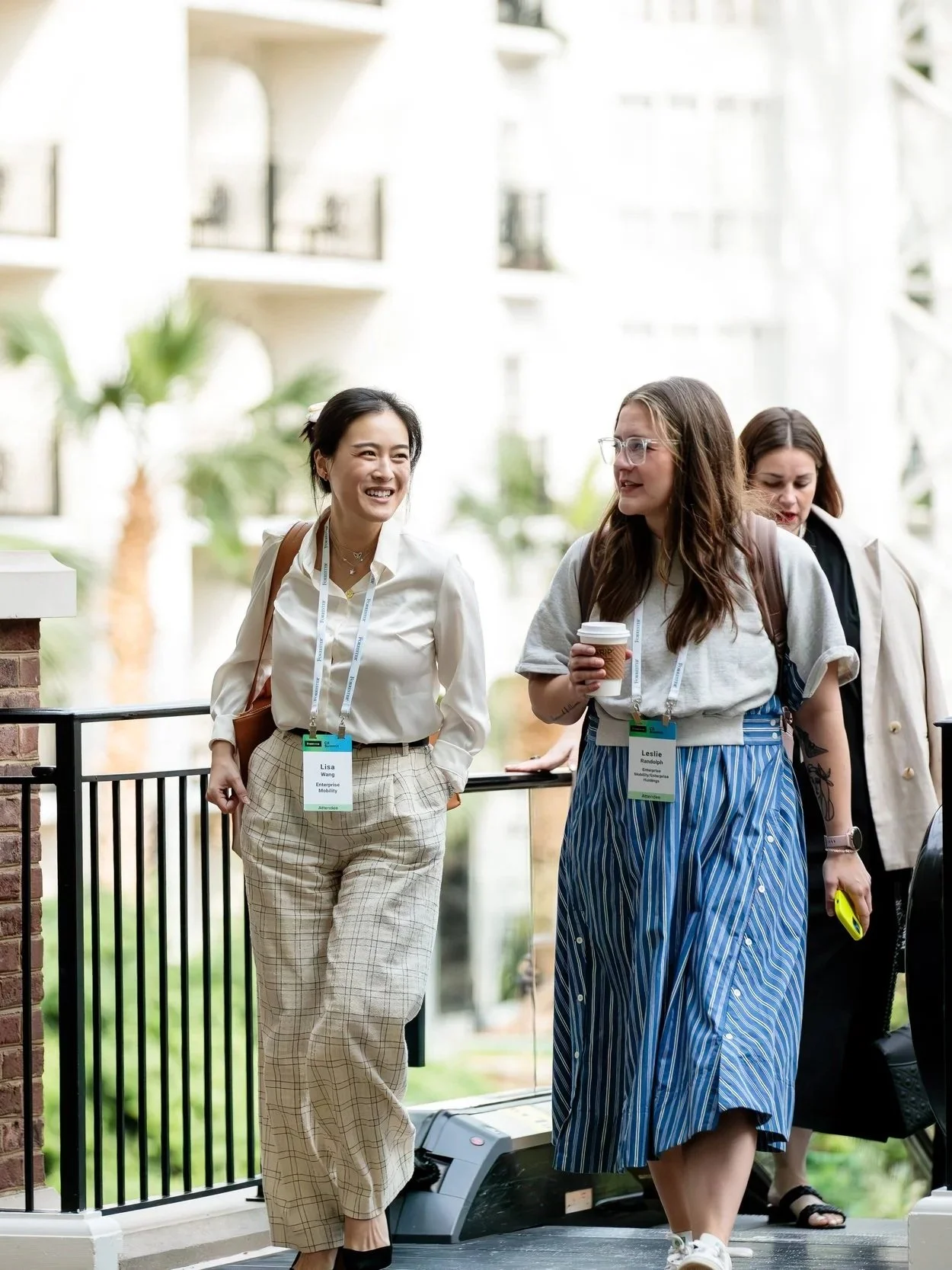 women getting off escalator heading to keynote at conference at opryland hotel resort and convention center in nashville, tn.