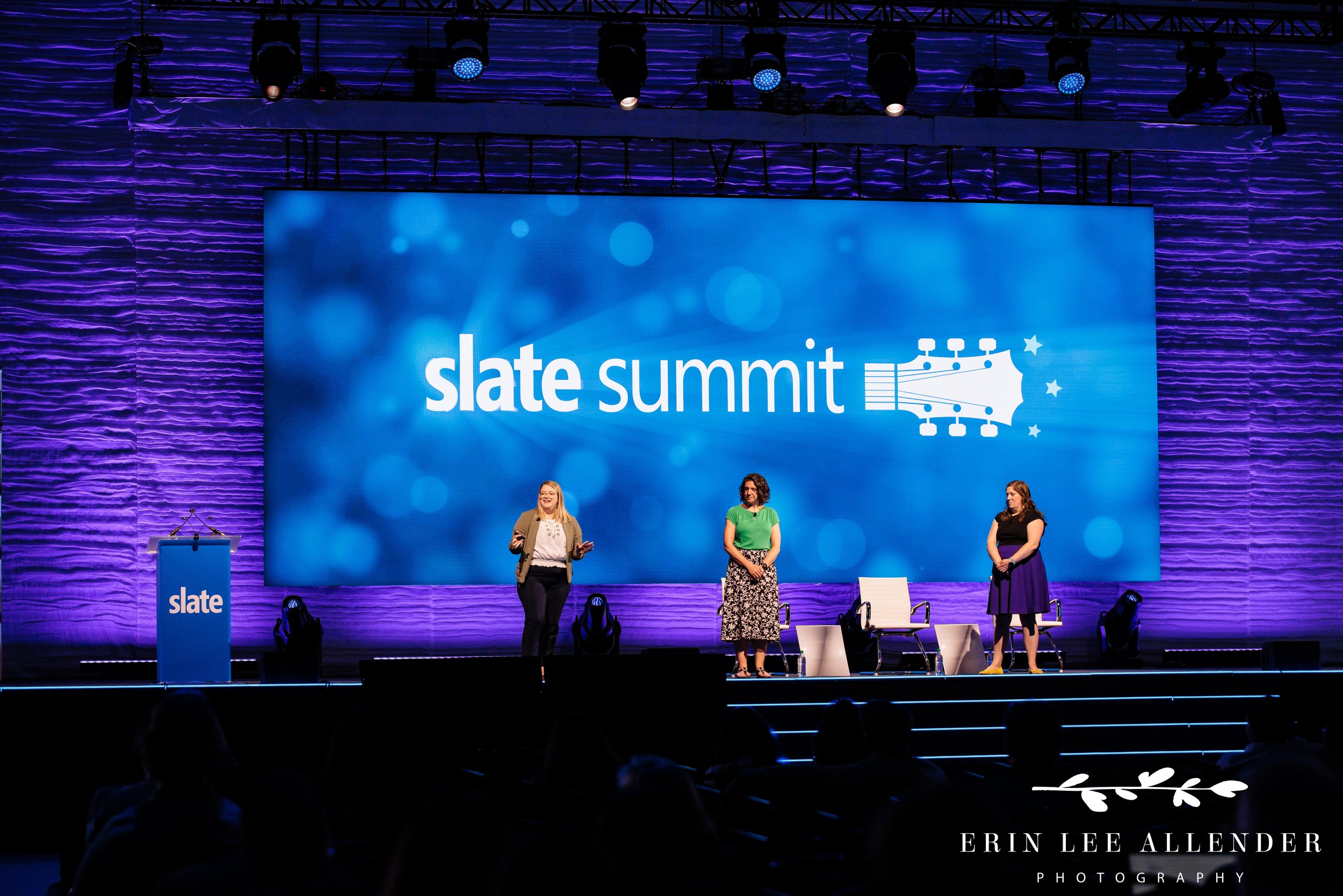 Nashville conference photography — wide shot of two Post Captain consultants on the mainstage during a Slate Summit breakout session