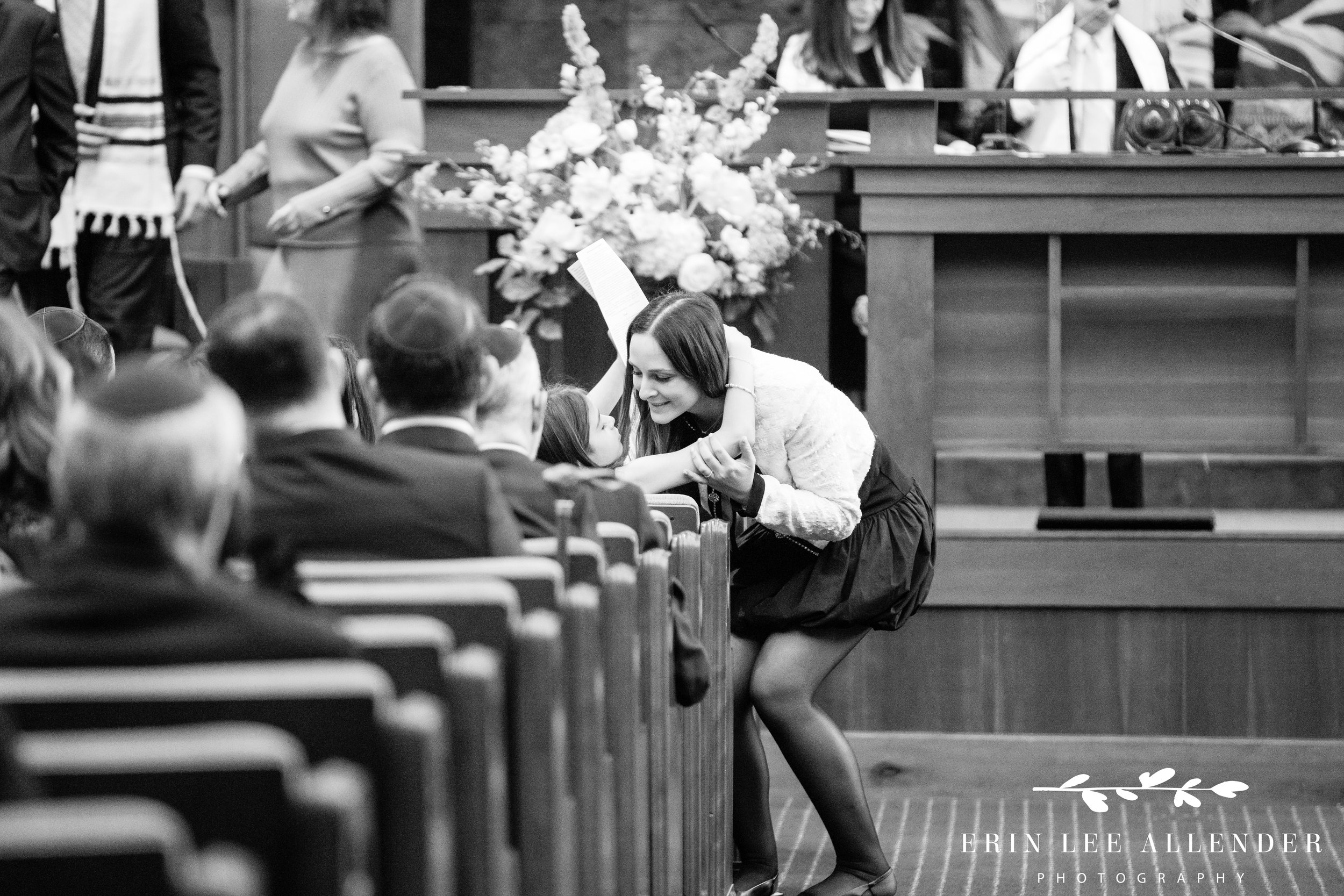 Aunt hugging sibling after reading aliyah bar mitzvah service the temple nashville