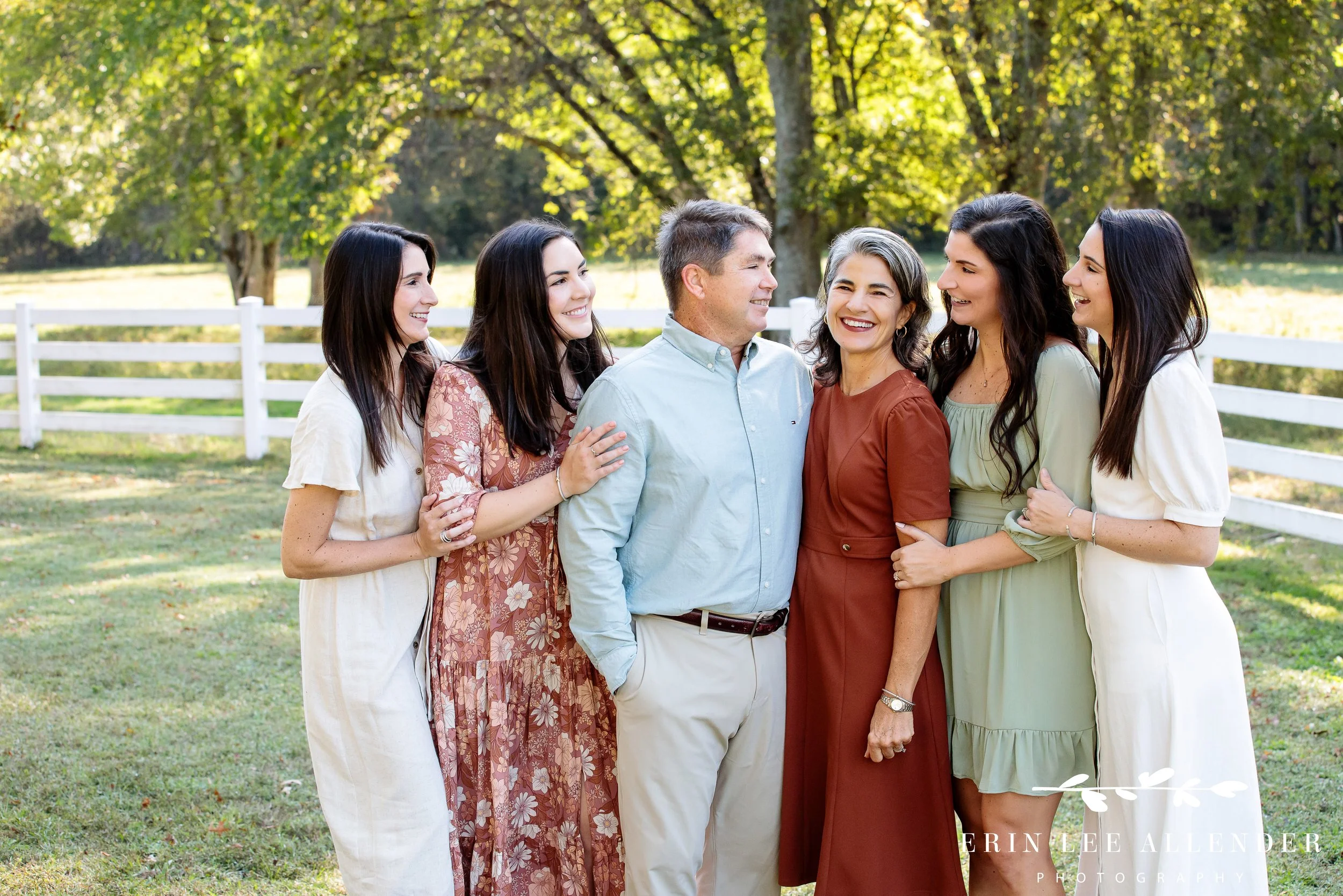 Nashville family photography — parents posing with their four adult daughters on the family farm