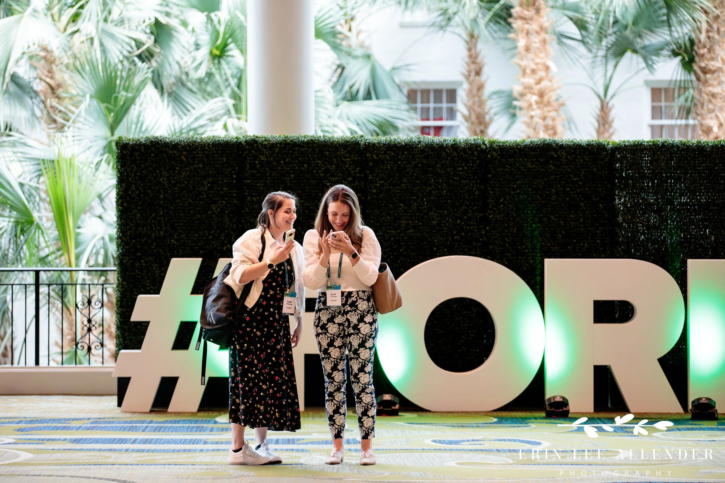 Attendees networking with large CX sign letters behind at corporate CX conference Gaylord Opryland Hotel