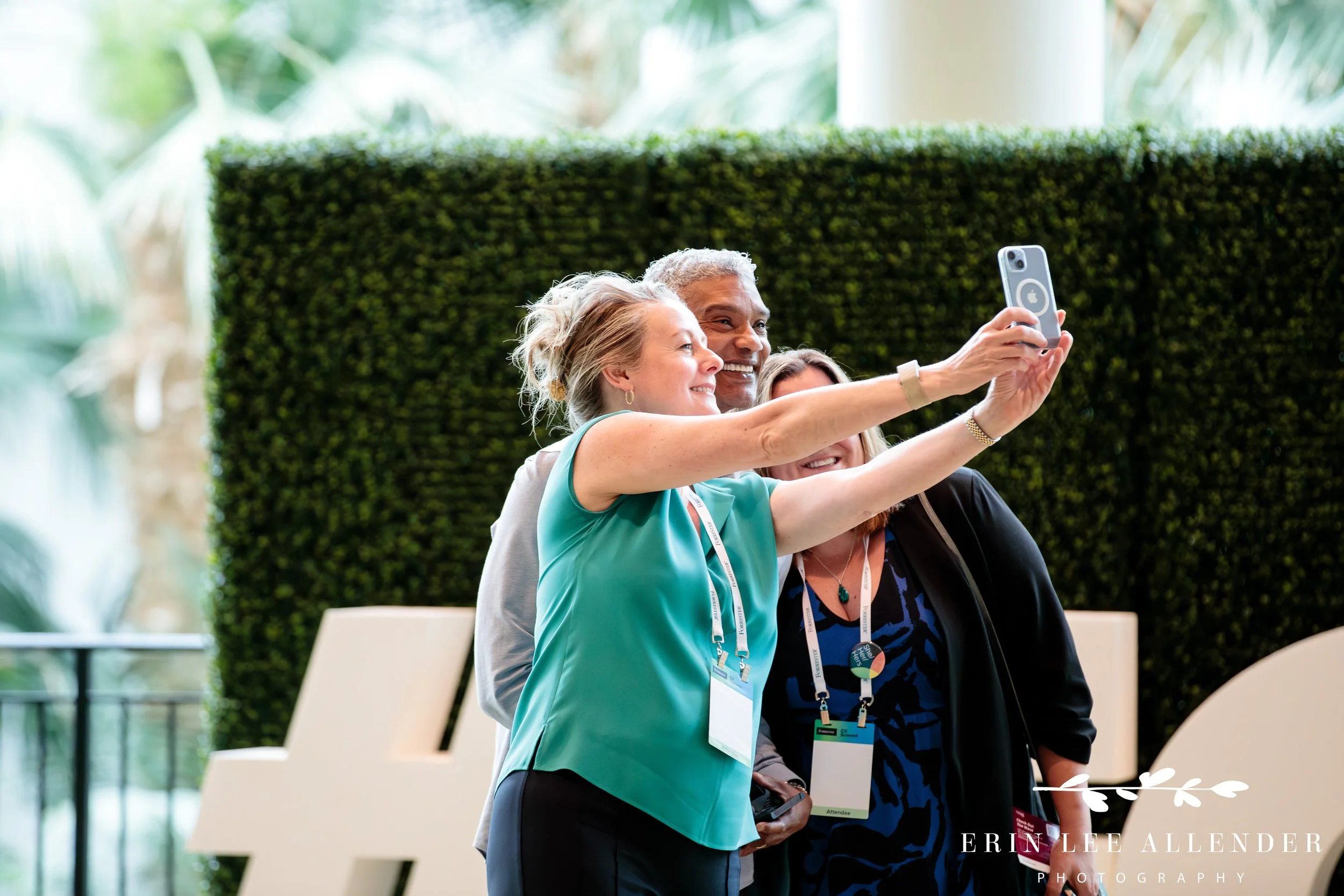 Guests taking a selfie during corporate CX conference registration at Gaylord Opryland Hotel