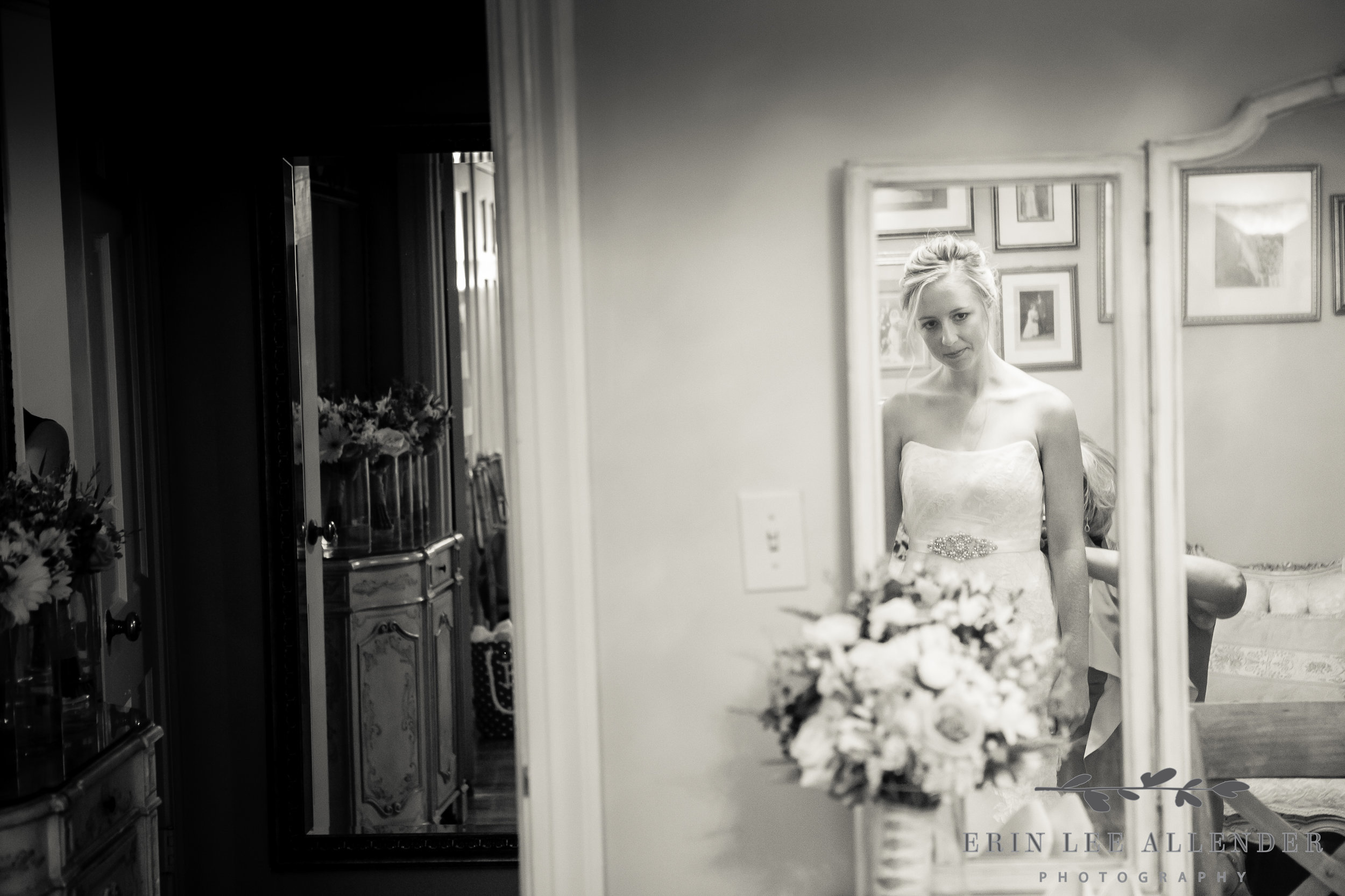 Bride_Looks_At_Herself_In_Mirror