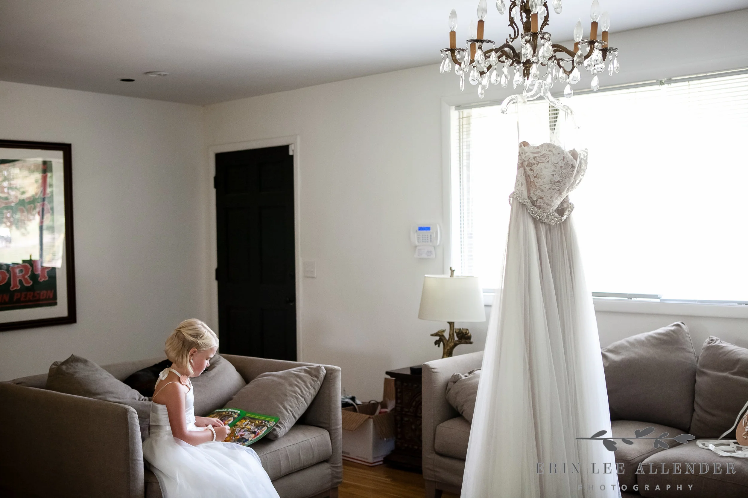 Flower_Girl_Sitting_By_Wedding_Dress