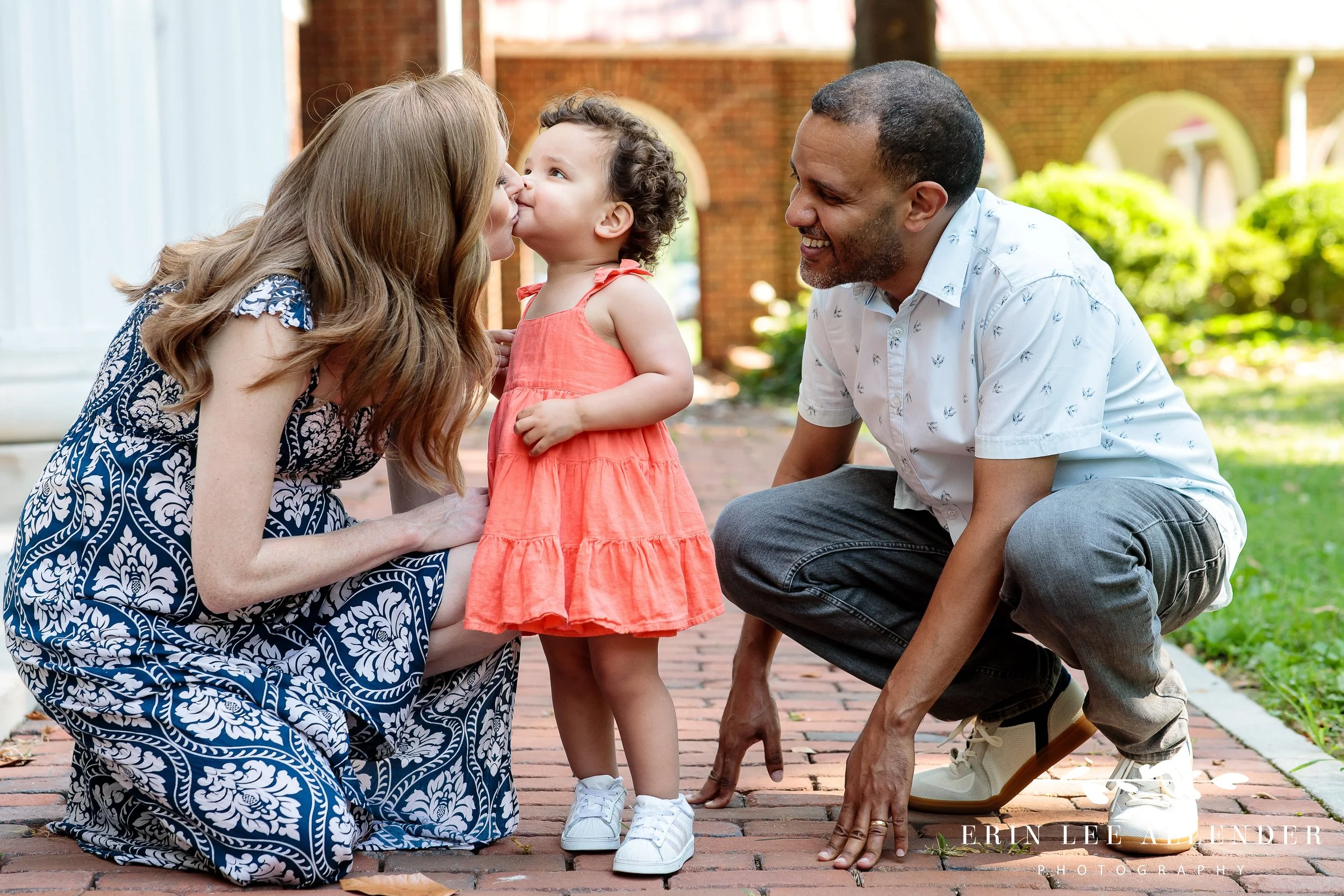Nashville maternity photographer — toddler girl kissing her mom at Ellington Agricultural Center