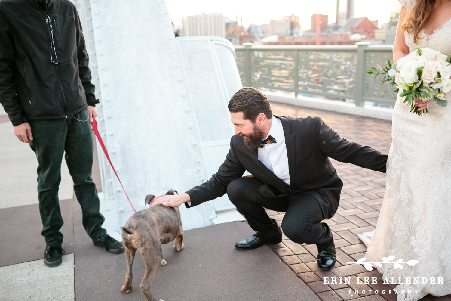 Groom_Pets_Dog_On_Bridge