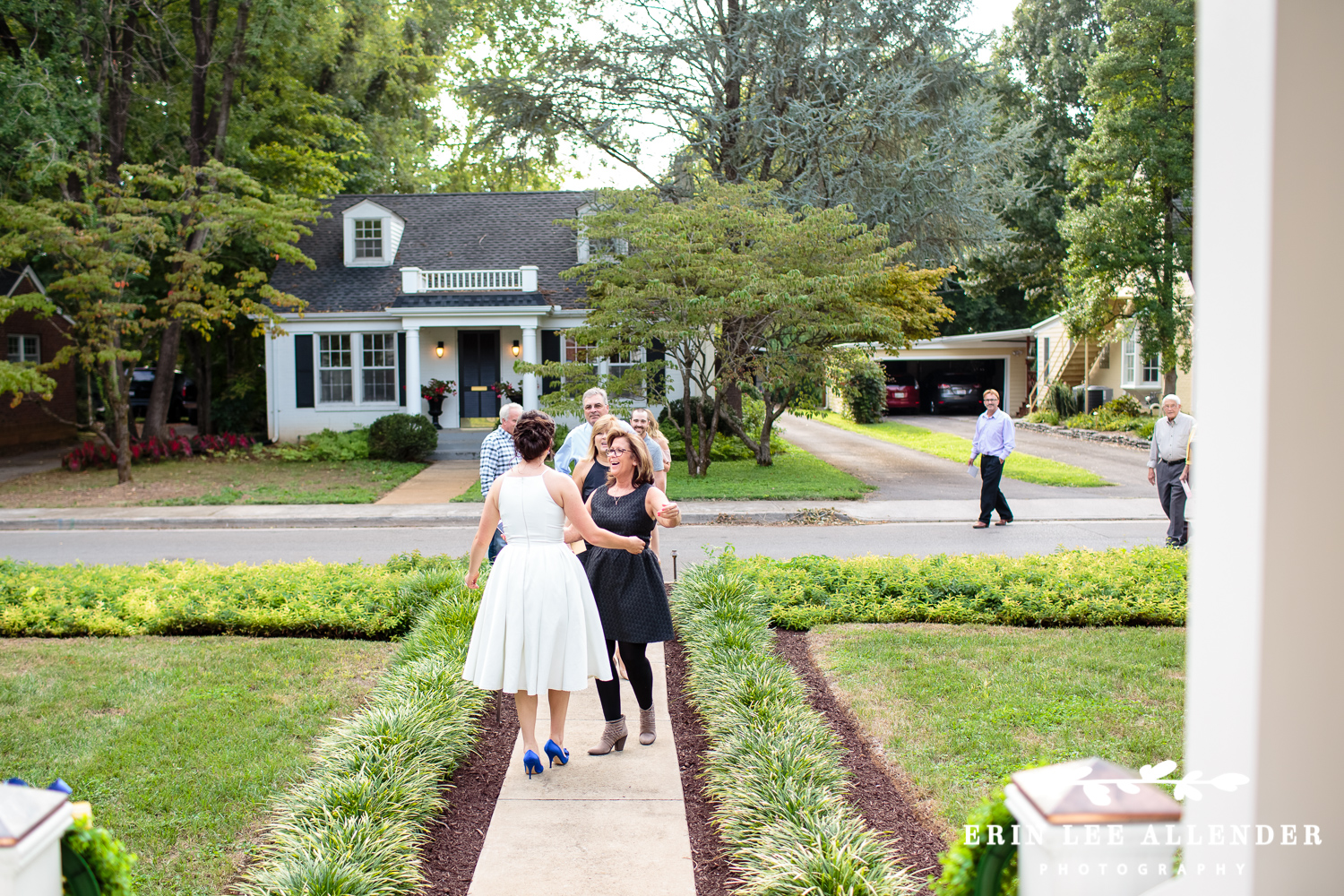 Bride_Greets_Guest_Backyard_Wedding