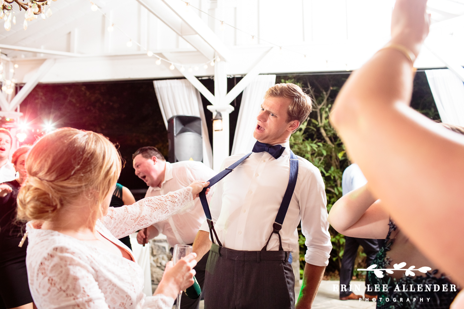 Bride_Pulls_Grooms_Suspenders
